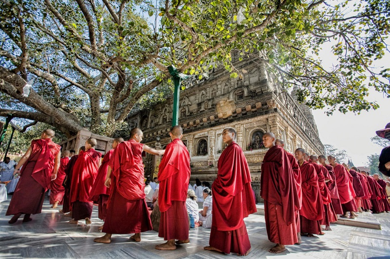 Monks surrounding a Tibetan Stupa