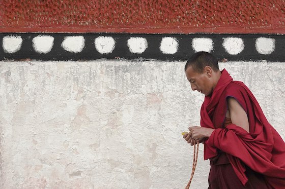 A_Tibetan_Pilgrim_Practicing_Kora-or-circumambulation-copy