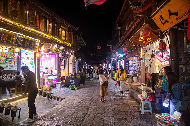 Lijiang, China- October 26, 2025: Tourist are at night market of Lijiang Old Town.