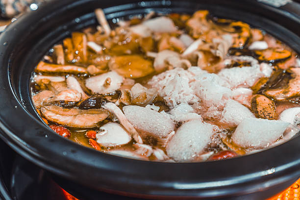 Yunnan traditional food. Mushroom chicken soup hotpot.
